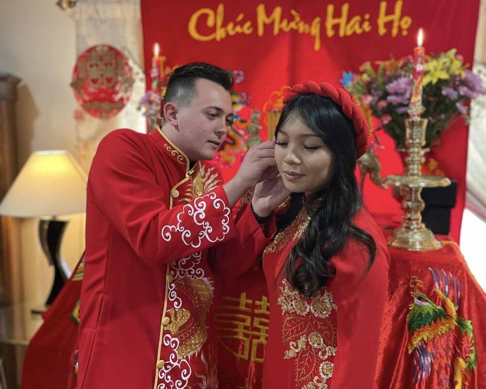 The groom gives a gift to the bride
