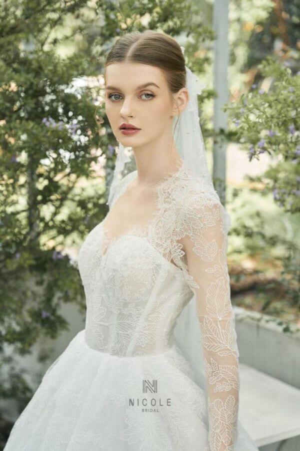The dress is designed with silk, lace and mesh material.